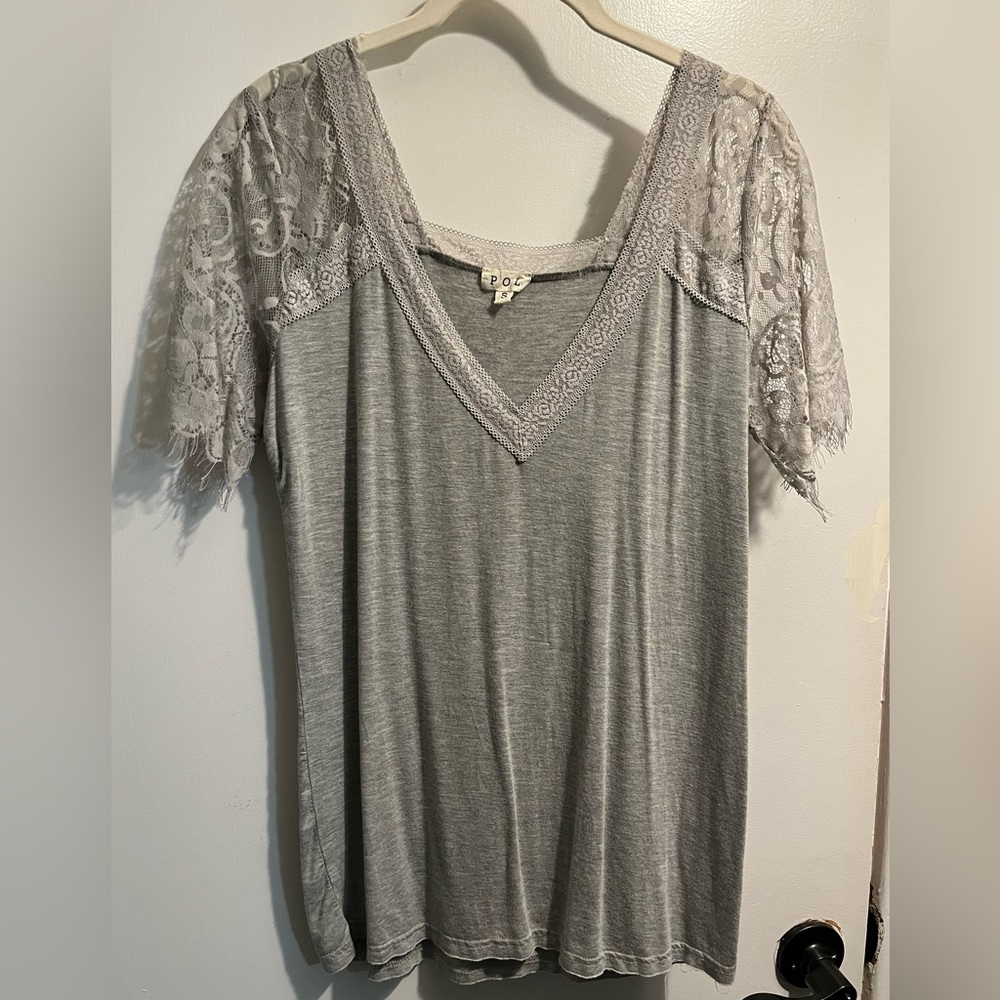 Boutique brand top with beautiful lace detail on top and sleeves, size small